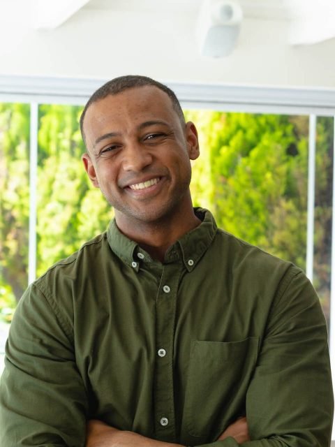 portrait-of-smiling-young-african-american-man-sta-2022-01-31-18-34-46-utc-e1659709905855.jpg